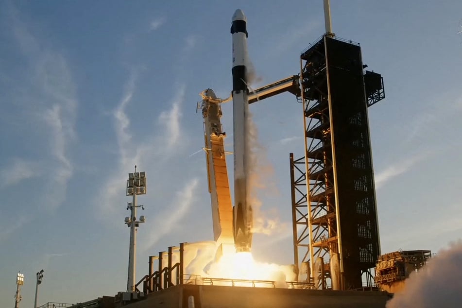 This screengrab image from NASA's live broadcast shows the SpaceX Falcon 9 rocket with the Crew Dragon capsule Endurance carrying the Crew-10 mission lifting off from Launch Complex 39A at NASA’s Kennedy Space Center in Florida on March 14, 2025.