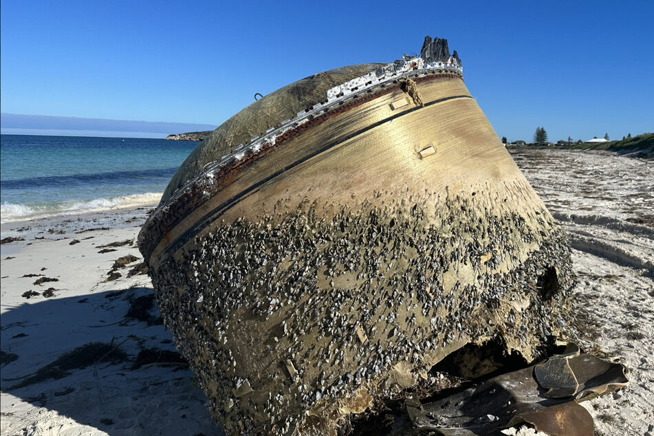A large, mysterious object washed up on a Western Australian beach on Monday, with authorities trying to figure out its origin.