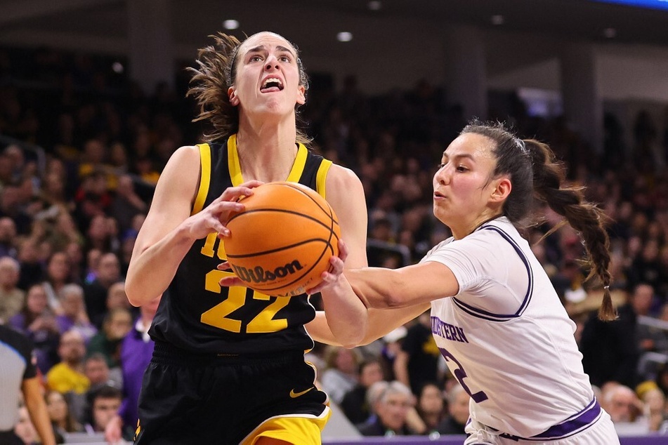 Iowa Hawkeye sensation Caitlin Clark (l) has officially etched her name in Big Ten history as the most formidable women's basketball player.