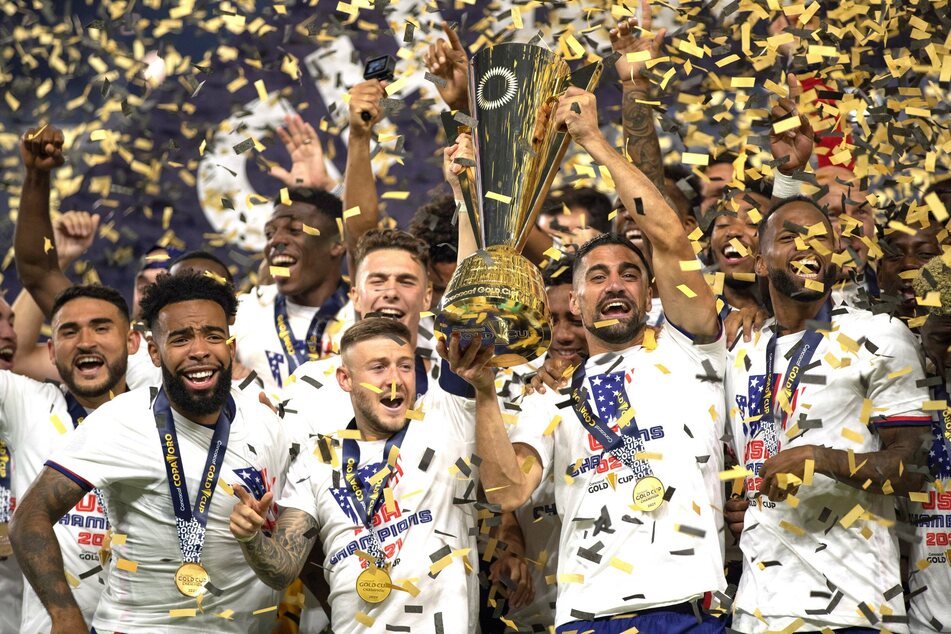 The US men celebrate their victory in the Gold Cup final on Sunday.