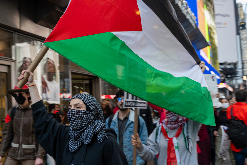 Supporters of Palestine participated in a rally in Times Square to condemn the recent fighting in Gaza on Friday.